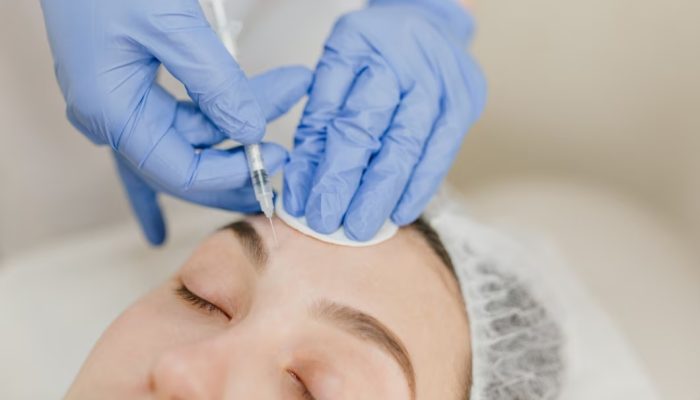 closeup-portrait-hands-blue-clinic-gloves-making-injection-womans-face-rejuvenation-injecting-profes